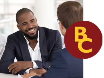 african american male smiling and talking with a banker